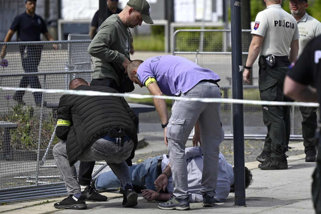 Police arrest a man after Slovak Prime Minister Robert Fico was shot on Wednesday. Photo: Radovan Stoklasa/TASR via AP