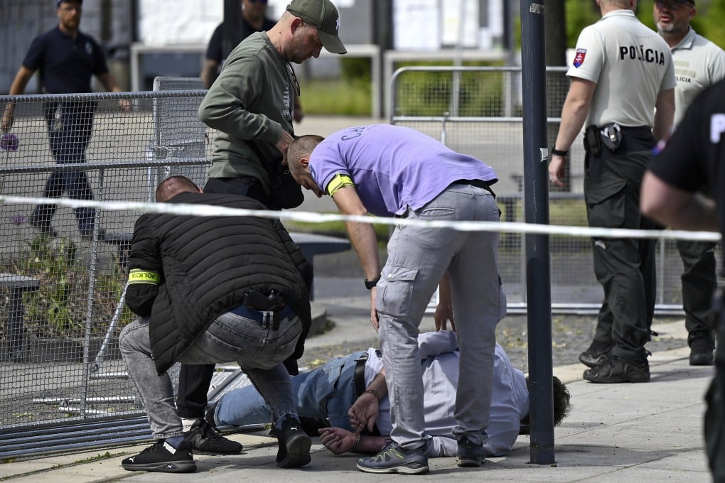 Police arrest a man after Slovak Prime Minister Robert Fico was shot on Wednesday. Photo: Radovan Stoklasa/TASR via AP