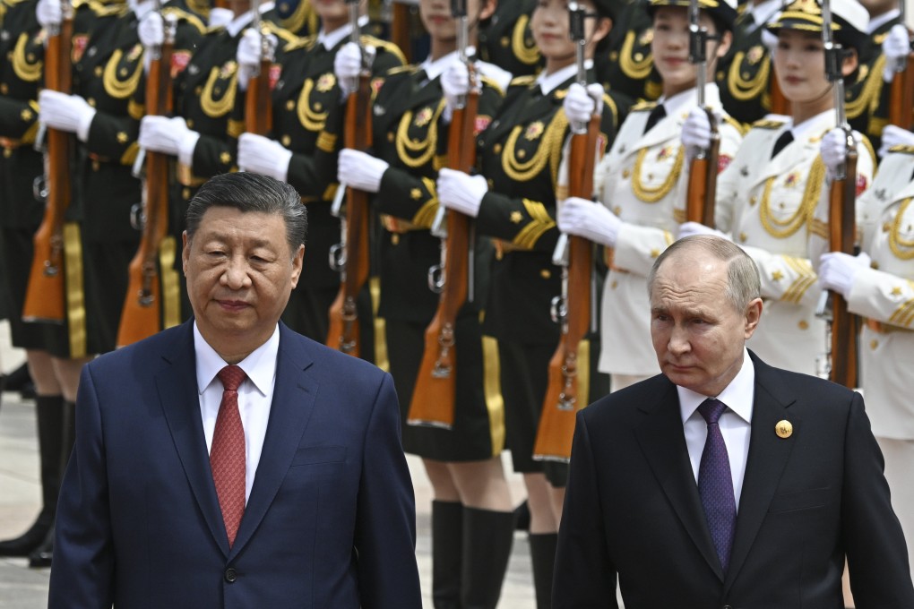 Chinese President Xi Jinping and Russian leader Vladimir Putin review an honour guard at a welcome ceremony in Beijing on Thursday. Photo: Pool via AP