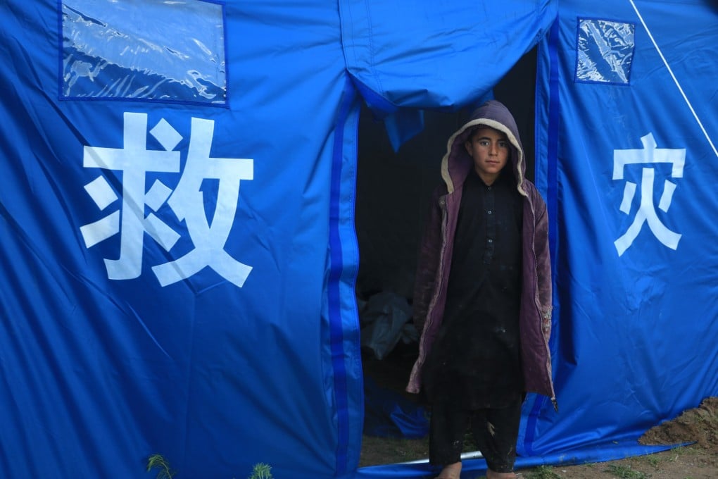 A child stands in front of a tent donated by China for flood-affected residents in Herat province, Afghanistan on May 4. Photo: Xinhua