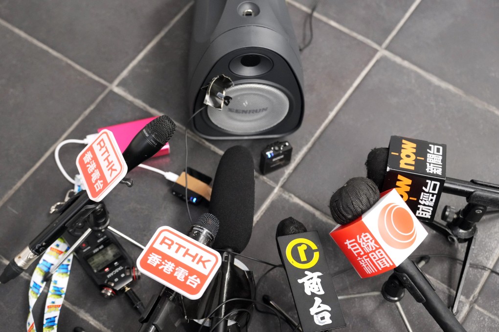 Microphones of different Hong Kong news organisations are placed near a speaker during a press conference at the West Kowloon High Speed Railway Station on April 15, 2024. Photo: May Tse