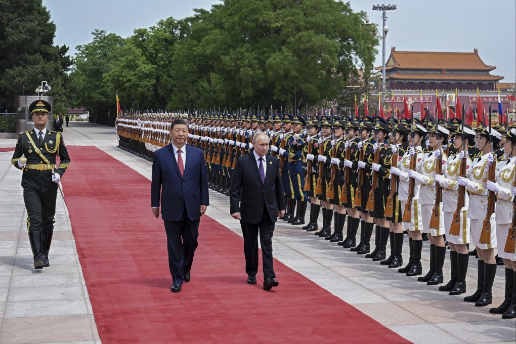 Chinese President Xi Jinping (left) and Russian President Vladimir Putin review the honour guard during a welcome ceremony at the Great Hall of the People in Beijing on Thursday. Photo: Xinhua via AP