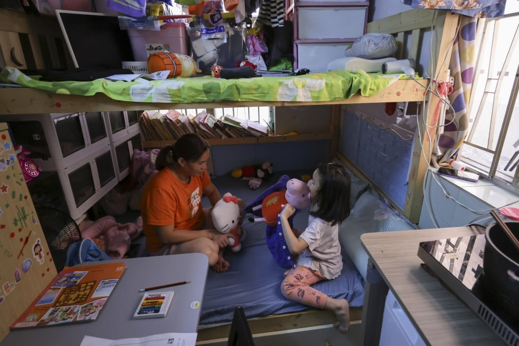 A mother and daughter in their subdivided flat in Sham Shui Po. Photo: May Tse