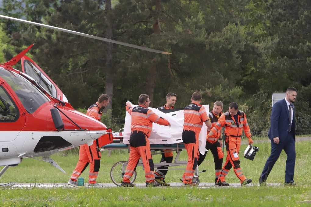 Rescue workers wheel Slovak Prime Minister Robert Fico, who was shot and injured, to a hospital on Wednesday. Photo: AP