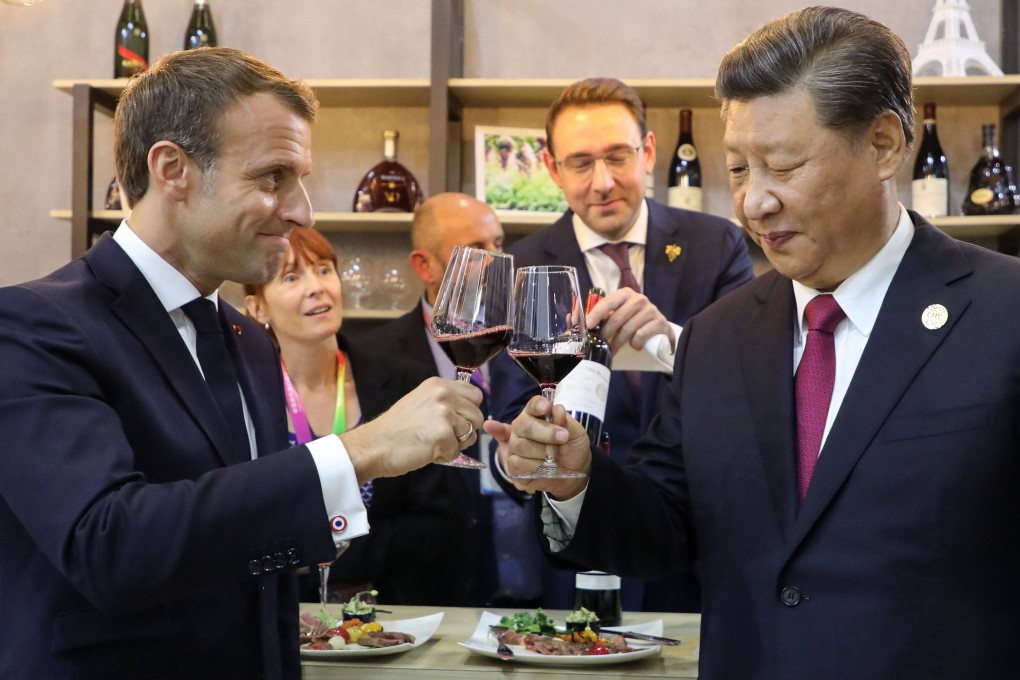 Chinese President Xi Jinping and French counterpart Emmanuel Macron visit the pavilion of France at the China International Import Expo, in Shanghai in November 2019. Photo: AFP