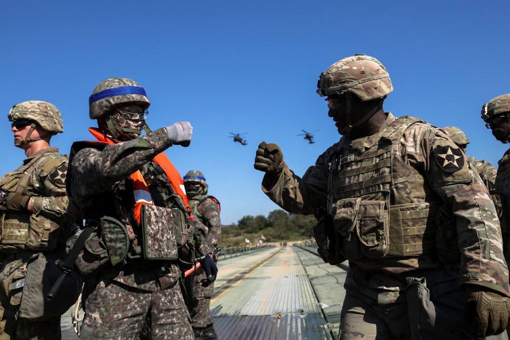 South Korean and US soldiers bump fists as they take part in a military drill in South Korea, in 2022. Photo: Reuters