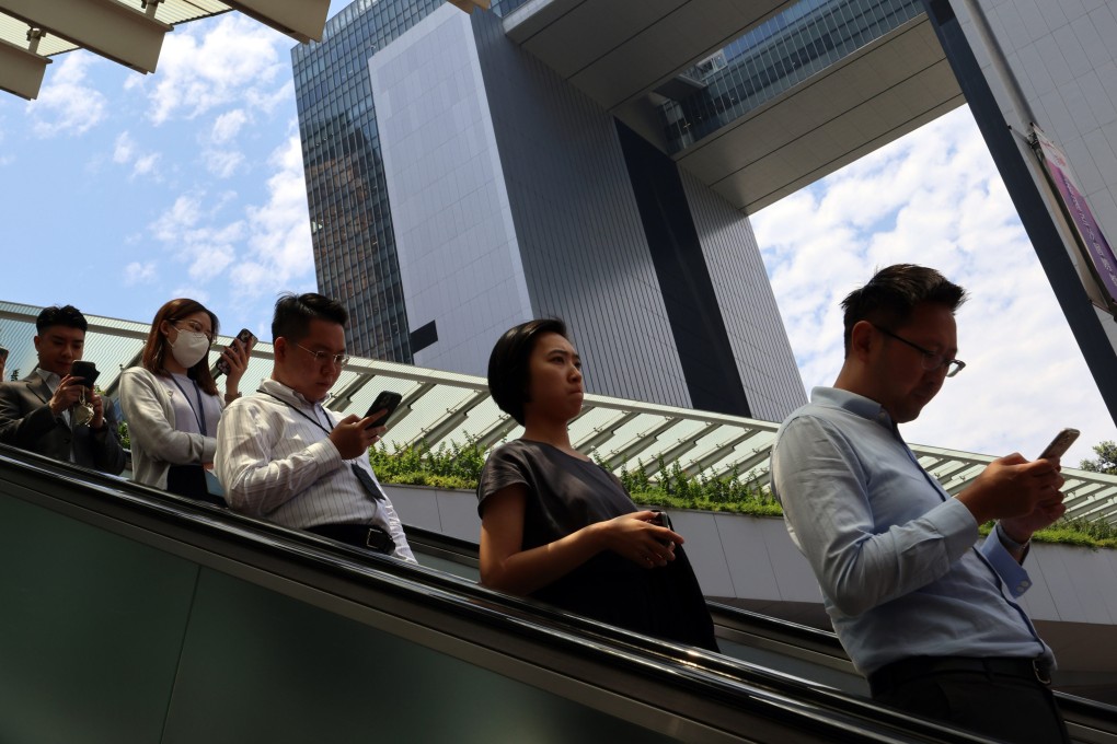 Civil servants leave the government offices in Tamar at lunch time on May 16. The 2024 Pay Trend Survey Report suggests rises of up to 5.47 per cent for civil servants this year. Photo: Jelly Tse