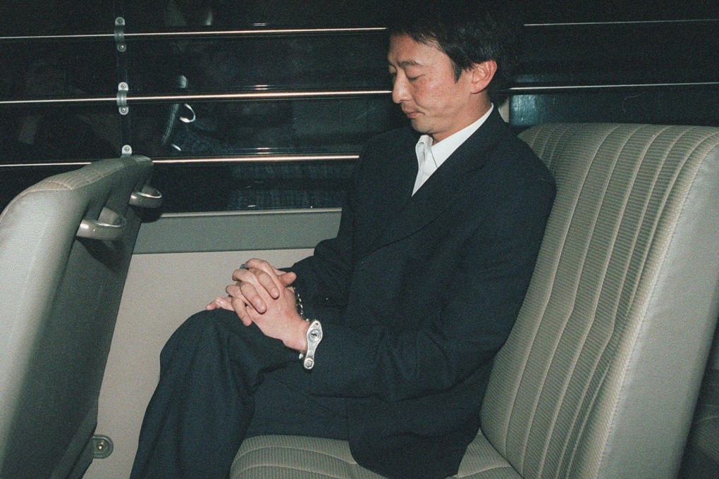 Hung Wai-tak leaves a Hong Kong court in handcuffs. The former Hong Kong jockey was charged in 1999 with raping an employee while his wife was away. Found guilty, he was sentenced to five years in prison for the crime. Photo: SCMP