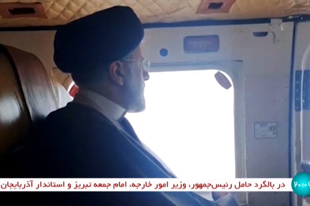 Iran’s President Ebrahim Raisi on board a helicopter on Sunday. Photo: IRINN via AFP