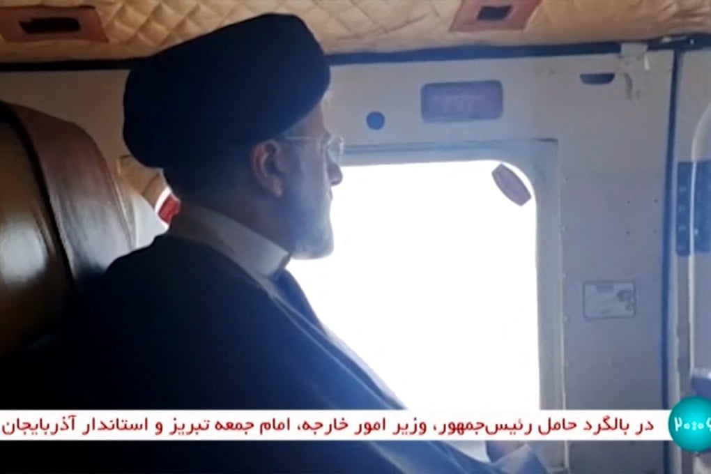 Iran’s President Ebrahim Raisi on board a helicopter on Sunday. Photo: IRINN via AFP