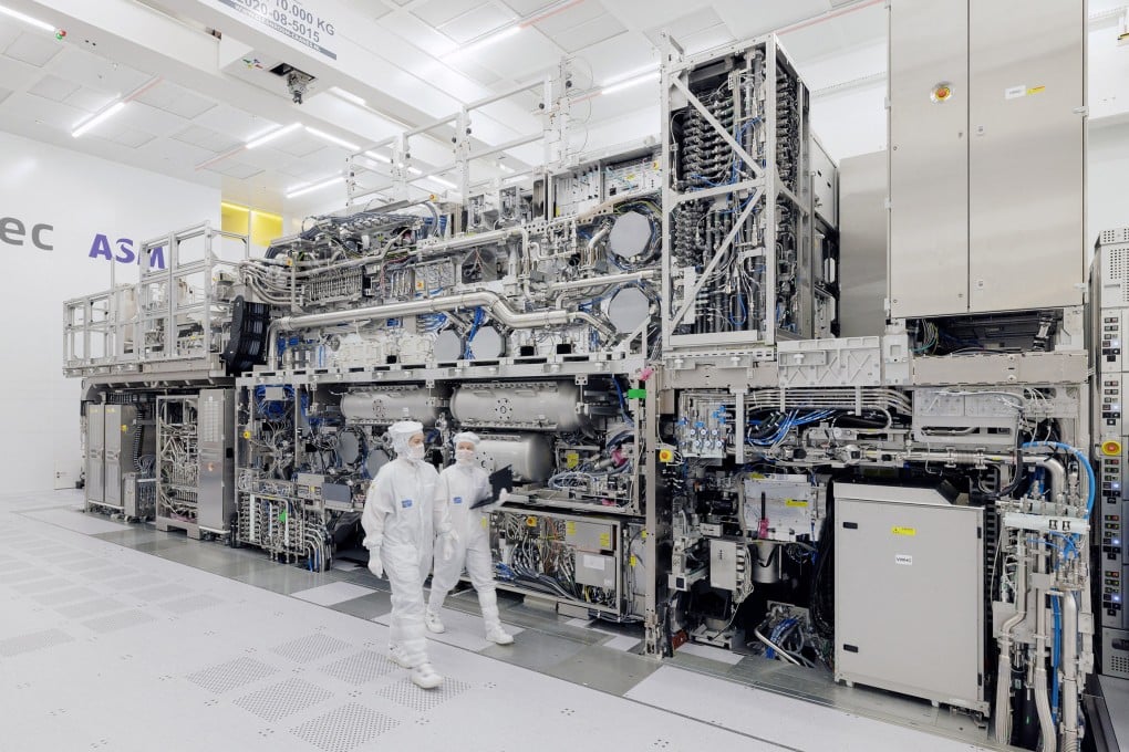 ASML engineers walk past a High NA EUV tool at ASML’s headquarters in Veldhoven, Netherlands, on November 20, 2023. Photo: Handout via Reuters
