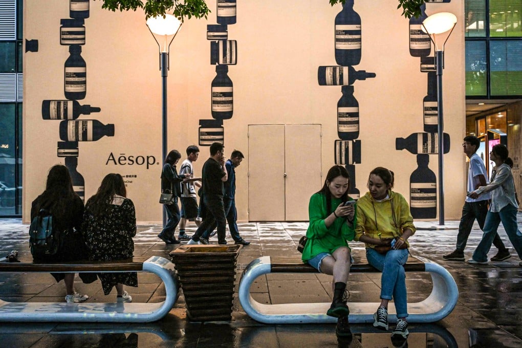 Shoppers visit a mall complex in Beijing on May 10, 2024. Photo: AFP