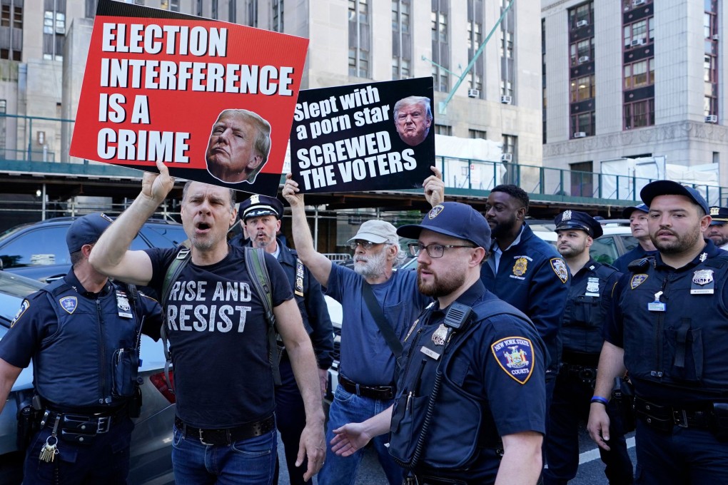 Anti-Trump protesters outside Manhattan Criminal Court in New York on Monday. Photo: AFP