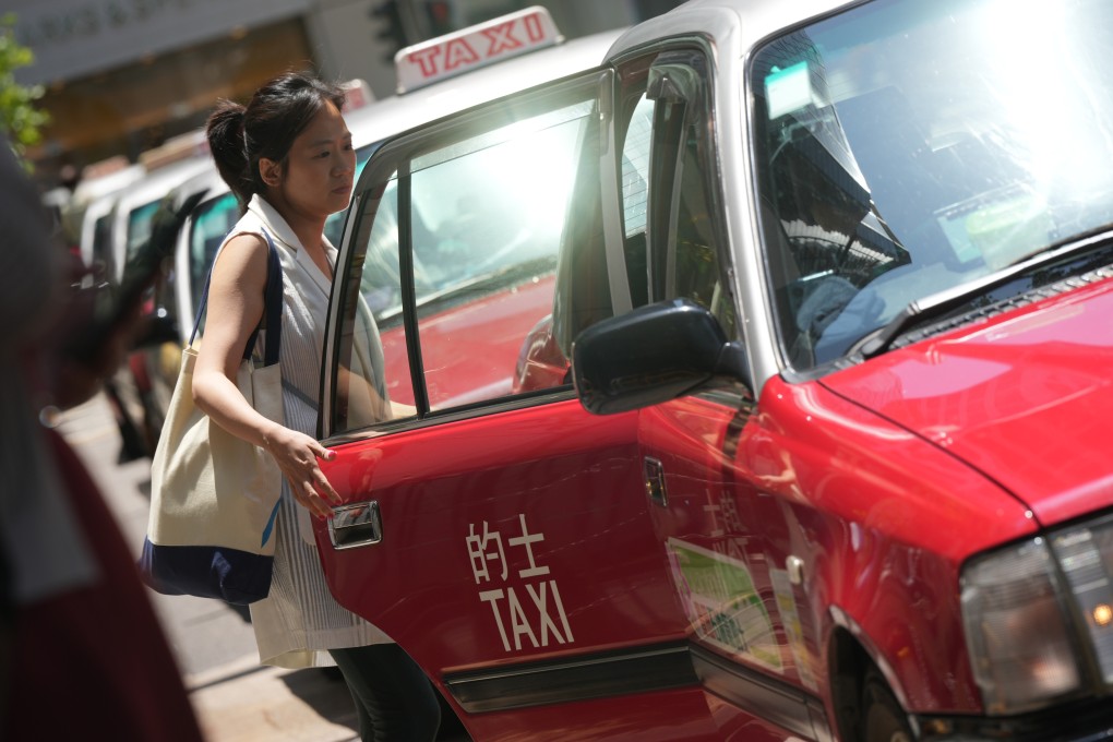 A customer boards a taxi in Central, Hong Kong. File photo: May Tse