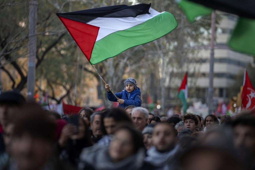 A boy waves a Palestinian flag in Barcelona, Spain, in January. File photo: AP