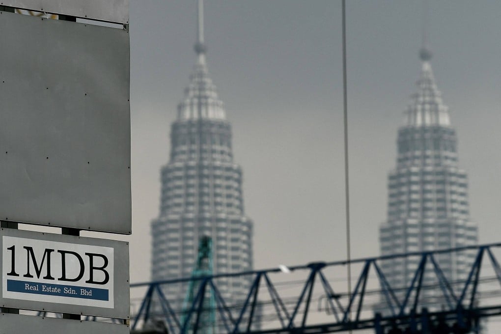 The 1MDB logo is seen on a billboard at the fund’s flagship Tun Razak Exchange under-development site in Kuala Lumpur. Photo: AFP