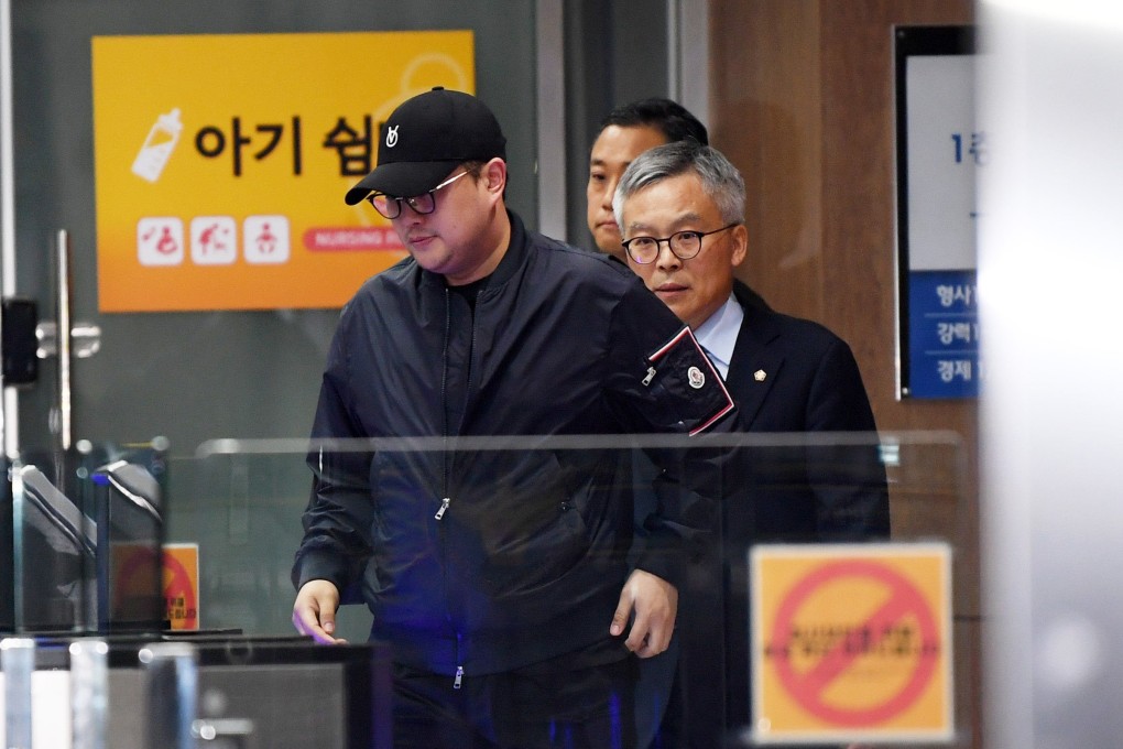 Singer Kim Ho-joong leaves a police station in Seoul’s Gangnam district on May 22. Photo: EPA-EFE/Yonhap