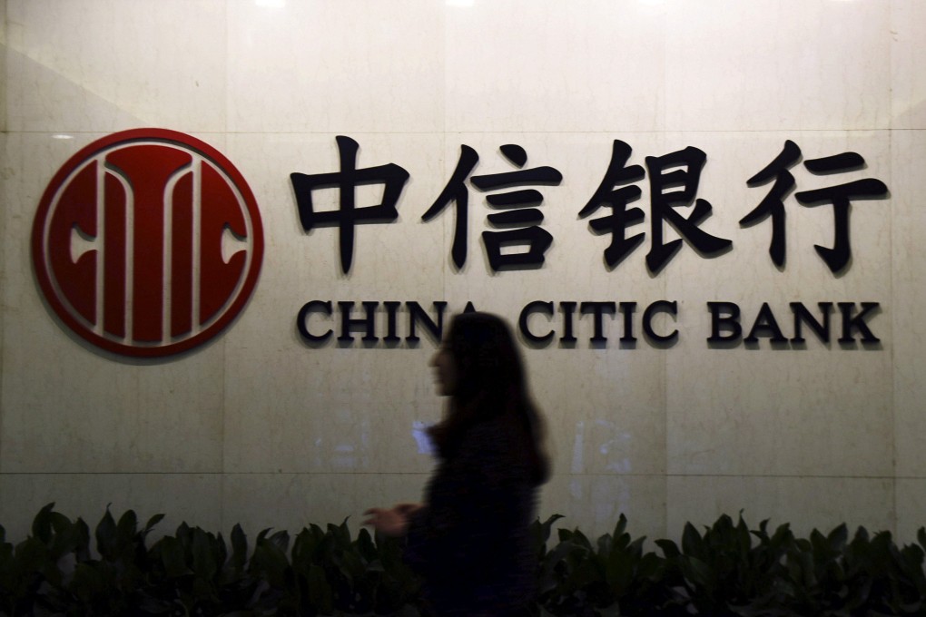 A customer walks past the company logo of China CITIC Bank, at a branch in Hangzhou, Zhejiang province, China. State-backed China Citic Bank has the biggest weighting on the CSI Dividend Index which has outperformed the main CSI 300 benchmark every year since 2021, when the market downturn commenced. Photo: Reuters