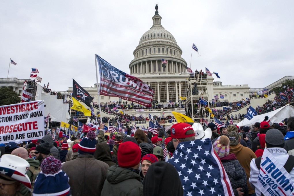 People loyal to then-US President Donald Trump rally at the US Capitol in Washington on January 6, 2021. Trump’s campaign to return to office has many voters concerned about potential chaos and election violence, but investors and fund managers appear to have no such fears. Photo: AP
