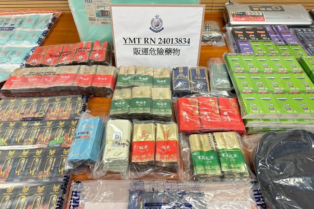 Police display items seized in a raid on a flat in Yau Ma Tei. Photo: Handout