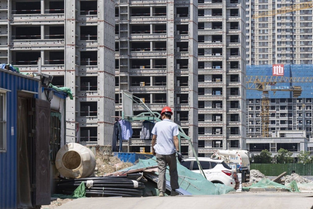 China’a asset management companies are increasingly expected to help keep other ailing sectors afloat, particularly the country’s embattled property developers. Photo: Bloomberg