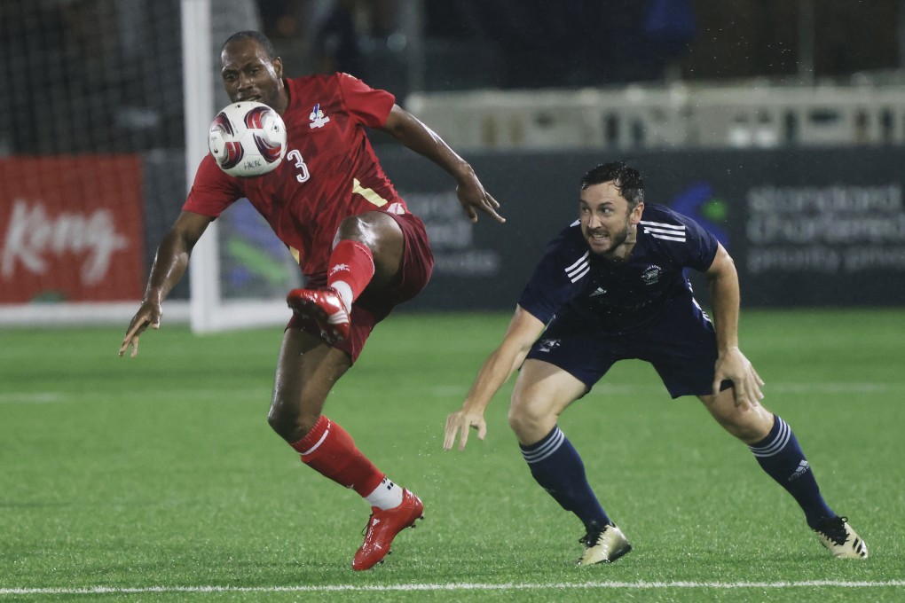 PFA All Stars’ Kyel Reid shields the ball from Shane Jeffery of HKFC Chairman’s Select at the Soccer Sevens. Photo: Jonathan Wong