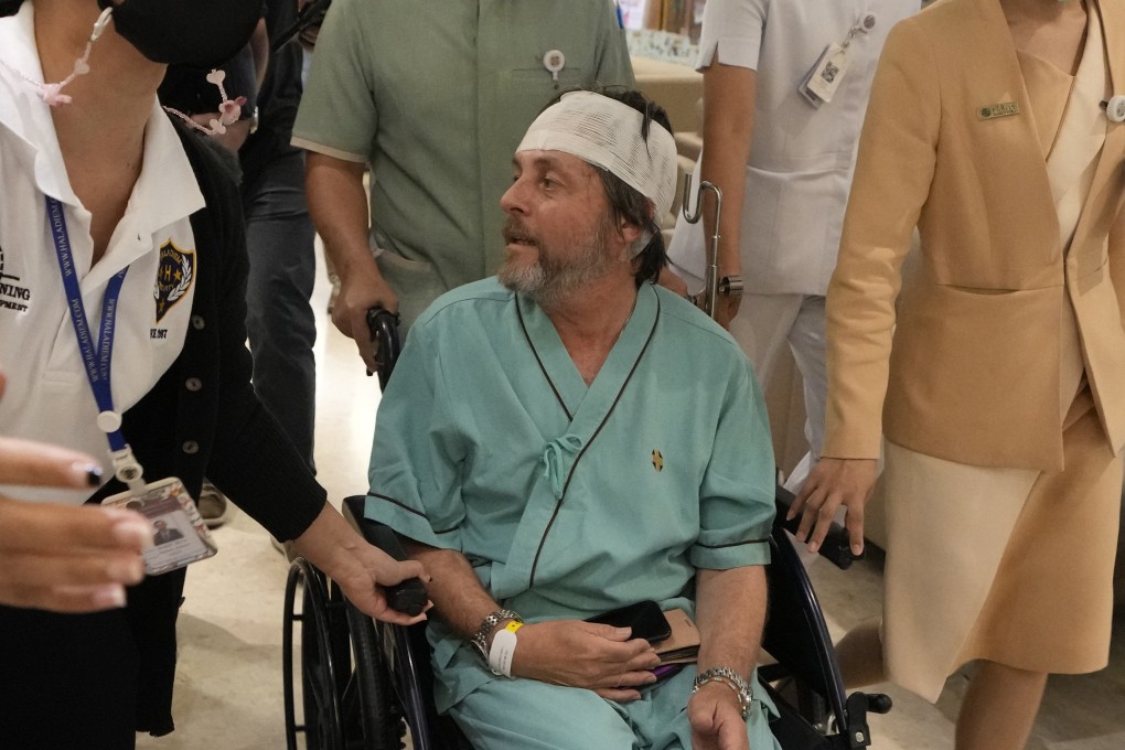 An Australian passenger, who was injured on a flight that was battered by severe turbulence, talks to reporters at Samitivej Srinakarin Hospital in Bangkok, Thailand on Thursday. Photo: AP