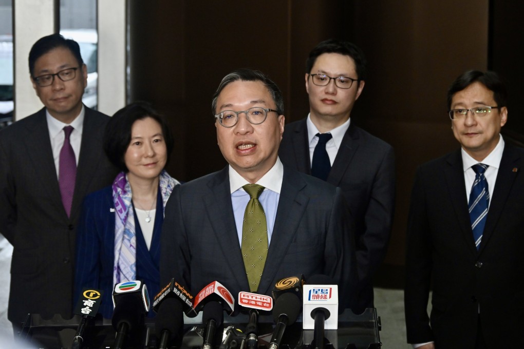 Justice minister Paul Lam (centre) says the US threats of sanctions will not affect his work. Photo: Handout