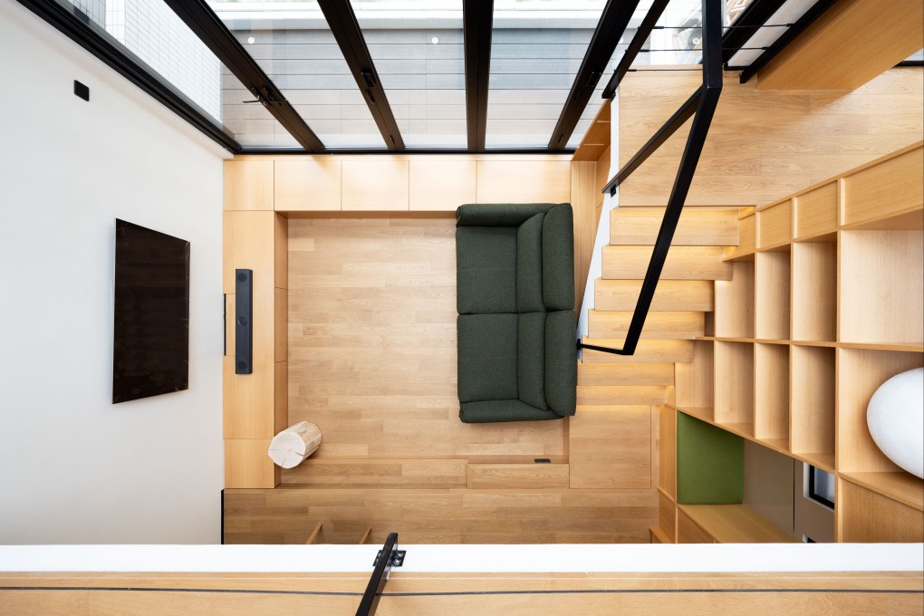 The living room of this Hong Kong village house in Tai Wai, with sunken floor, double-height ceiling and integral staircase, built for a bachelor who likes to entertain, shows the potential to move far beyond the cookie-cutter design of most such homes. Photo: Eugene Chan