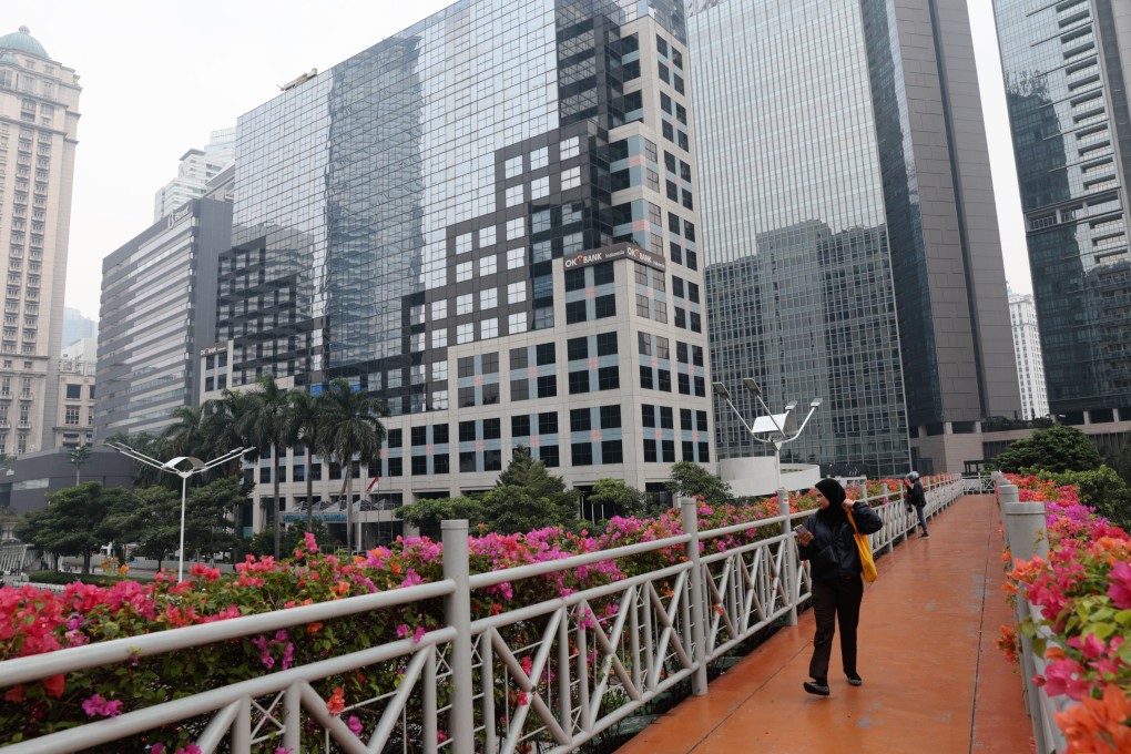 A person walks on a pedestrian bridge in Jakarta, Indonesia earlier this month. Photo: EPA-EFE