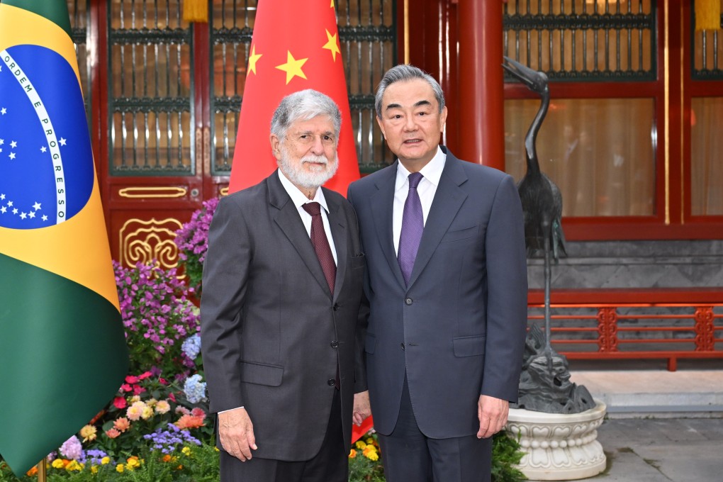 Wang Yi (right), China’s foreign minister, welcomes Celso Amorim, a top adviser to Brazilian President Luiz Inacio Lula da Silva, in Beijing on Thursday. Photo: Xinhua