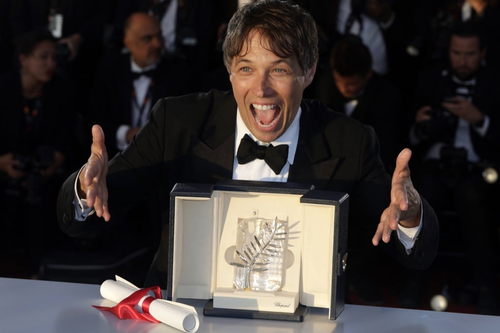 Sean Baker poses with the Palme d’Or for Anora after the closing and awards ceremony of the 77th annual Cannes Film Festival on Saturday. Photo: EPA-EFE