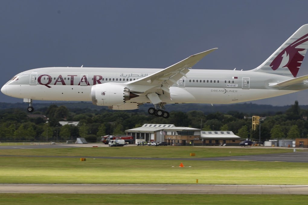 A Qatar Airways Boeing 787 Dreamliner lands during an aerial display in England. Photo: AP