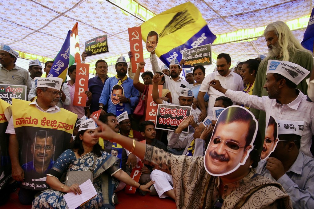 Members of the Aam Aadmi Party, Communist Party of India (CPI) and other NGOs hold placards and shout slogans against the Indian prime minister during a protest against the arrest of Delhi Chief Minister Arvind Kejriwal, in Bangalore on March 31. Photo: EPA-EFE