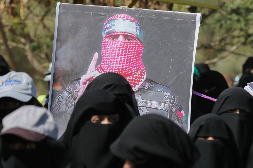 A poster of Abu Ubaida, the spokesman of the al-Qassam Brigades, is carried by university students during a rally to show support for the Palestinians in the Gaza Strip in Sanaa, Yemen, in January. Photo: Reuters