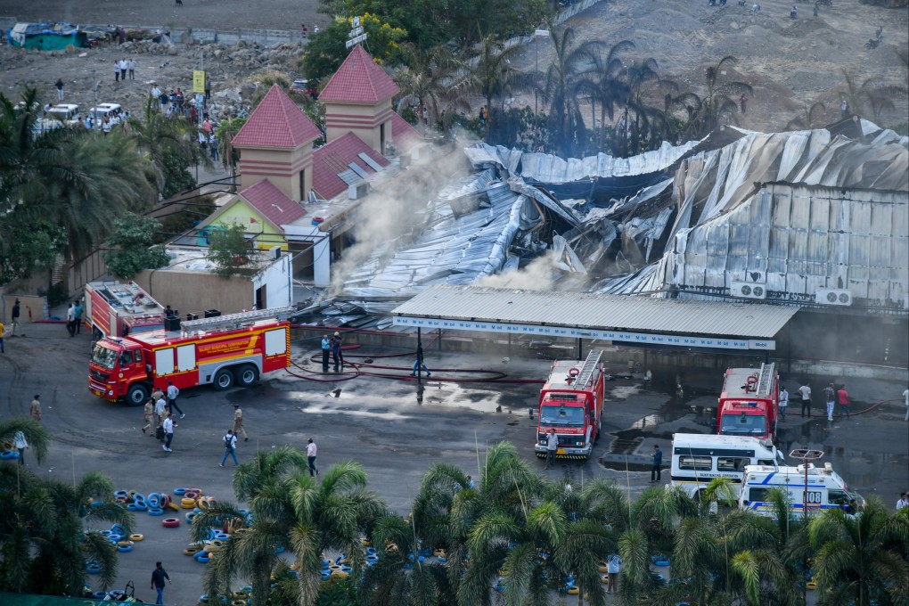 Indian firefighters undertake a rescue operation after a massive fire broke out at TRP Gaming Zone in Rajkot, in the western state of Gujarat, on Saturday. Photo: EPA-EFE