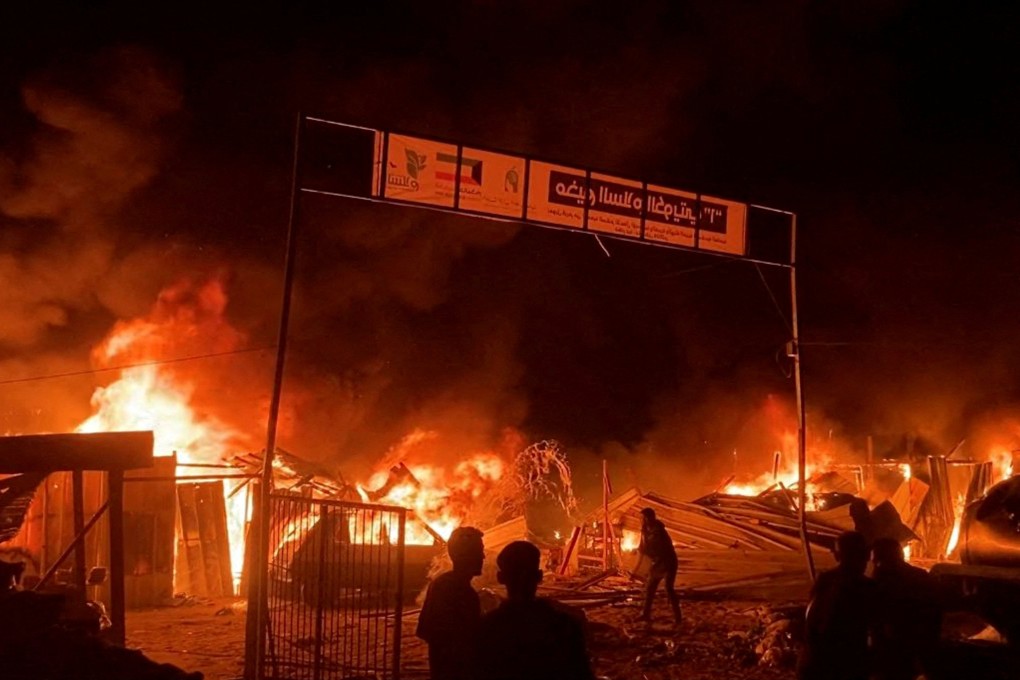 Fire rages following an Israeli strike on an area designated for displaced Palestinians in Rafah, southern Gaza on Sunday. Photo: Reuters