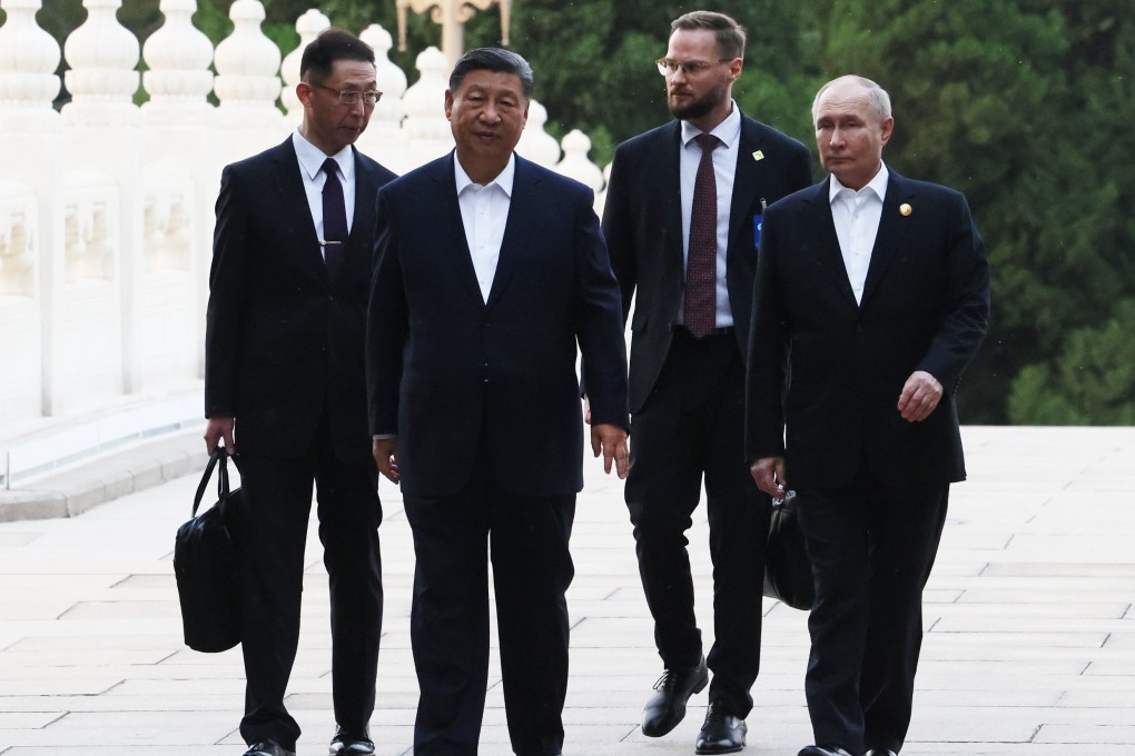 Russian President Vladimir Putin and Chinese President Xi Jinping during an informal meeting in Beijing. Photo: EPA-EFE