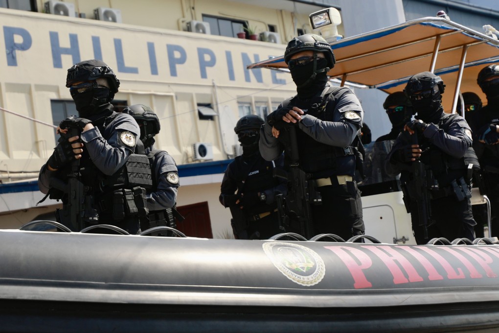 Philippine coastguard personnel on a rubber boat at a ceremony at a seaport in Manila. Photo: EPA-EFE