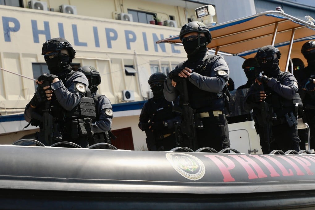 Philippine coastguard personnel on a rubber boat at a ceremony at a seaport in Manila. Photo: EPA-EFE