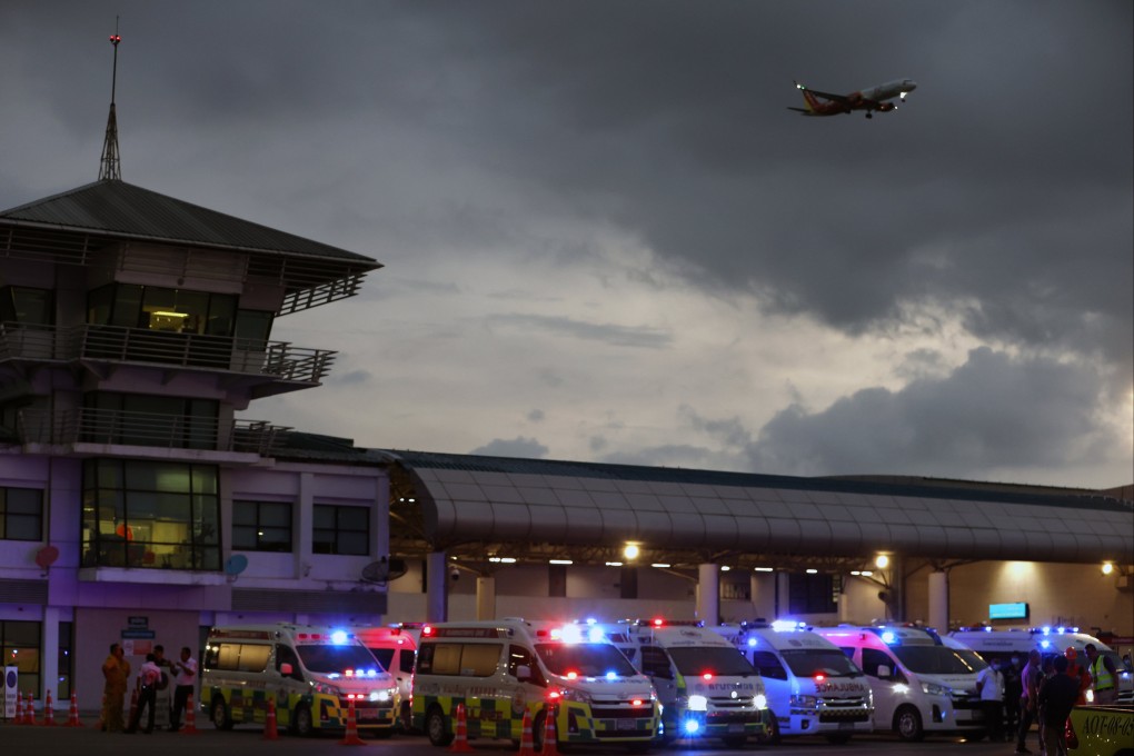 Medical personnel and ambulances wait for injured passengers from Singapore Airlines Flight SQ321 at Suvarnabhumi International Airport in Thailand on May 21. Photo: EPA-EFE