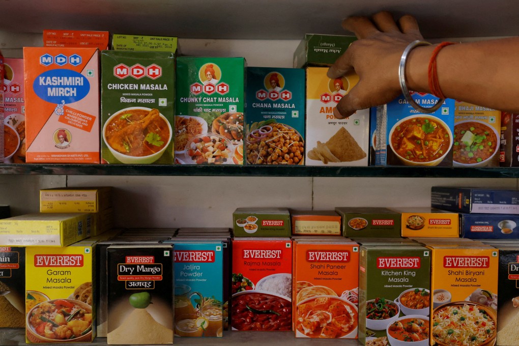 Spice boxes of MDH and Everest on the shelf of a shop at a market in New Delhi. Photo: Reuters