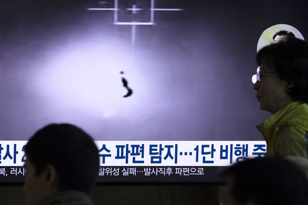People watch a television screen broadcasting news of North Korea’s failed launch of a military spy satellite at a station in Seoul on Monday. Photo: EPA-EFE