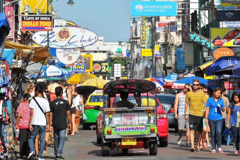 Tourists walk along backpacker haven Khao San Road in Bangkok, Thailand. Photo: Shutterstock/File