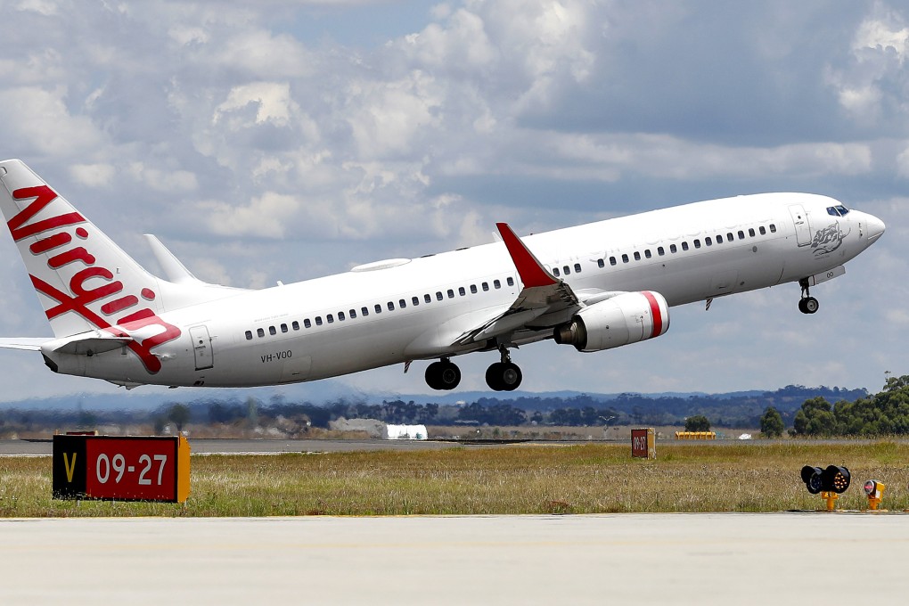 A man accused of running naked down the aisle of an Australian domestic flight, knocking down a flight attendant and forcing the plane to turn back, has been arrested. Photo: AP