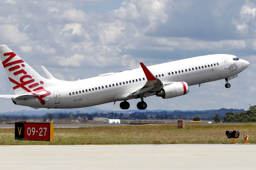 A man accused of running naked down the aisle of an Australian domestic flight, knocking down a flight attendant and forcing the plane to turn back, has been arrested. Photo: AP