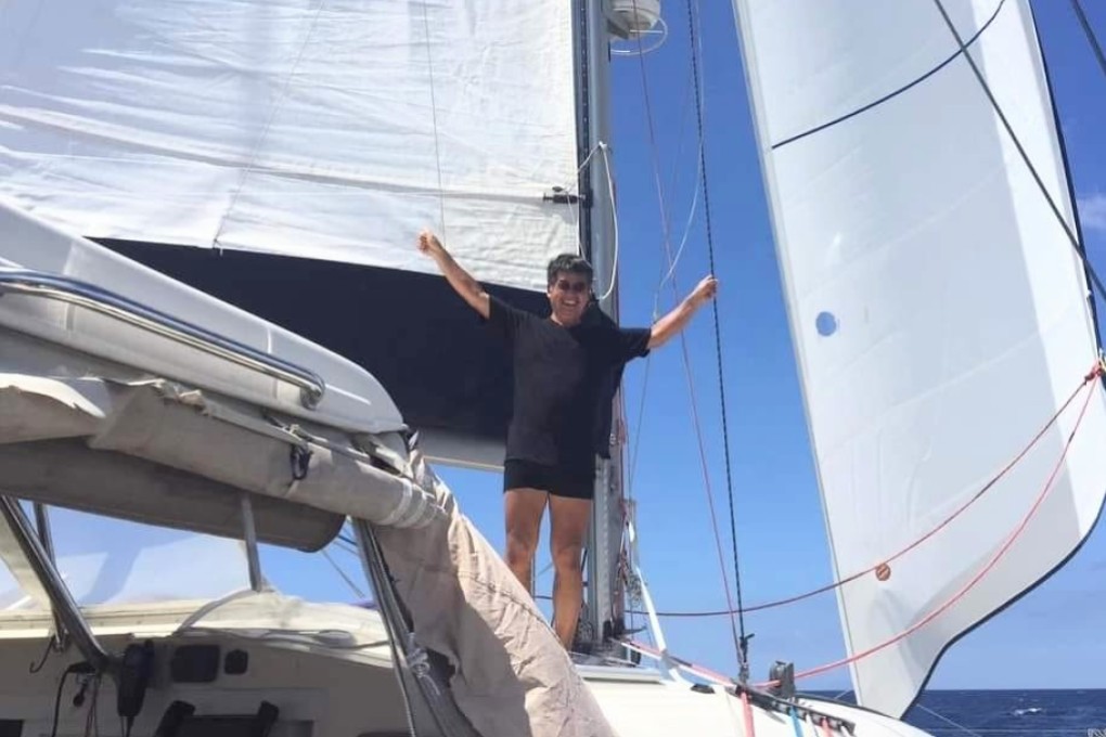 Retired actuary Andy Kuo Lee on board Our Rose, his 44-foot sailing catamaran, in 2023. Lee and a crewmate had to abandon the vessel and swim for their lives after it started letting in water in the Luzon Strait during a trip from the Philippines to Taiwan. Photo: Andy Kuo Lee
