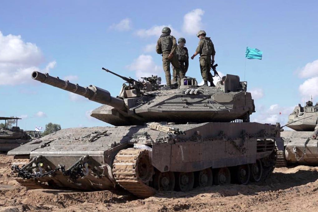 Israeli soldiers stand atop a tank in eastern Rafah in the southern Gaza Strip amid the ongoing conflict in the Palestinian territory between Israel and Hamas. Photo: Israeli Army/AFP