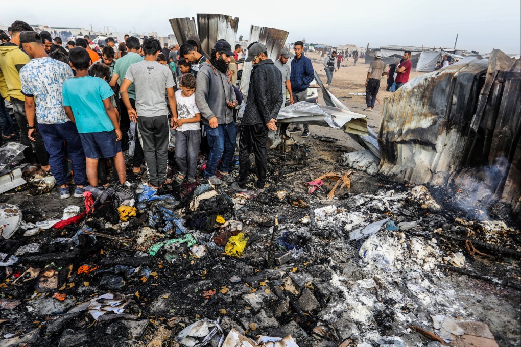 Palestinians inspect their destroyed tents after an Israeli air strike, which resulted in numerous deaths and injuries, in the Al-Mawasi area. Photo: dpa