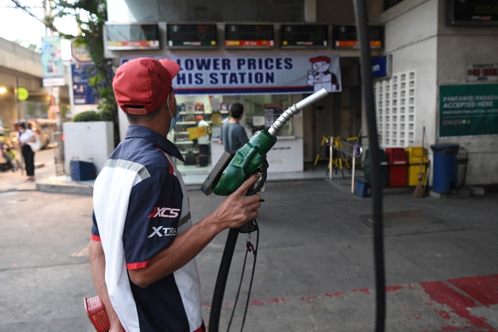 An attendant prepares to fill a customer’s vehicle with fuel at a petrol station in Manila. Proponents argue that the Philippines could subsidise fuel prices if it developed its own South China Sea energy reserves. Photo: AFP